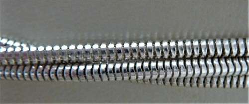 An Elegant Three Chain Silver Coloured Necklace