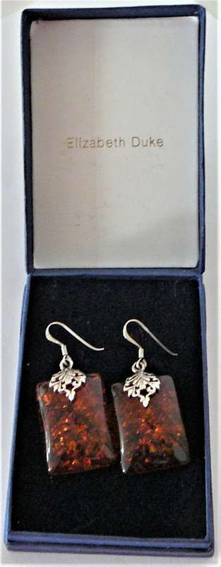 A Charmin Pair of Amber Earrings set in Sterling Silver