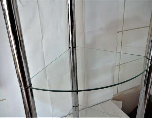 A Three Shelf Glass and Chrome Corner Unit
