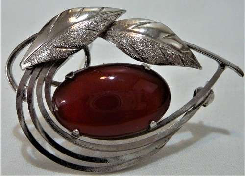 A Really Nice Silver Coloured  Brooch set with an Amber Coloured Stone