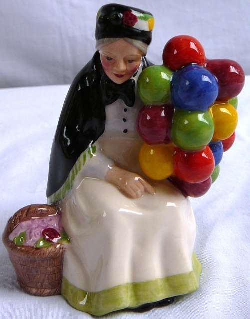 A Royal Doulton Miniature from the Street Vendors Series The Old Balloon Seller