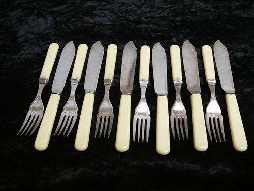 Set of Six EPNS Plastic Handled Fish Knives and Forks.