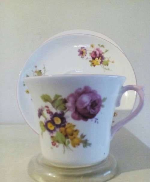 Gossamer thin fine porcelain tea trio by Shelley. Pretty pink edged floral design.