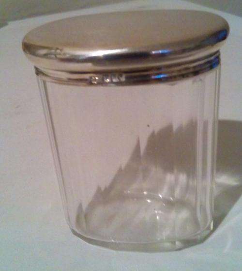Antique sterling silver oval lidded dressing table jar.