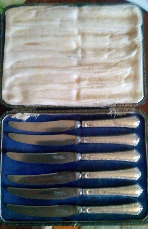 Boxed set of silver handled butter knives by Mappin and Webb-possibly 1897.