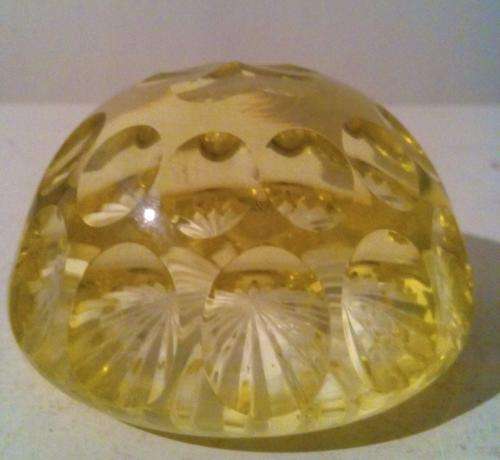 Lemon yellow multi patterned glass paperweight.