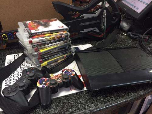 PS3 55 GB CONSOLE & 10 GAMES INCLUDING GUITAR HERO & GUITAR