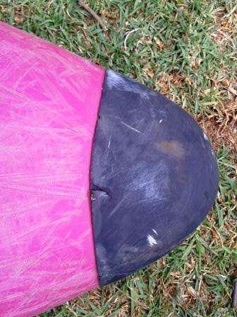 White water kayak underside showing scratches from use in river