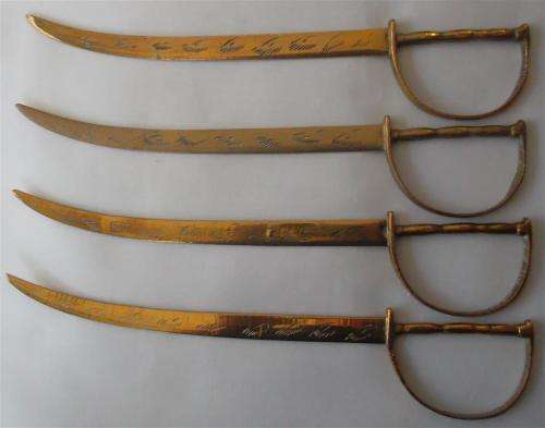 Set of 4  Vintage Brass Swords