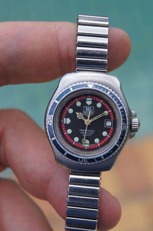 TAG HEUER LADIES RED AND  BLACK TIMEPIECE