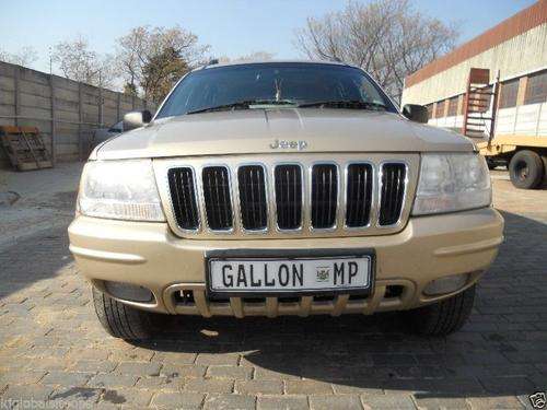Gold Jeep Grand Cherokee