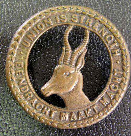 South African Defence Force cap Badge - Union is strength - Springbok facing left, 48mm