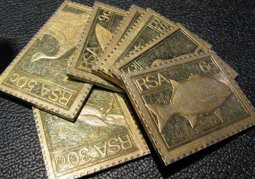 240g of Sterling Silver(0.925) in the form of gold plated stamp plaques