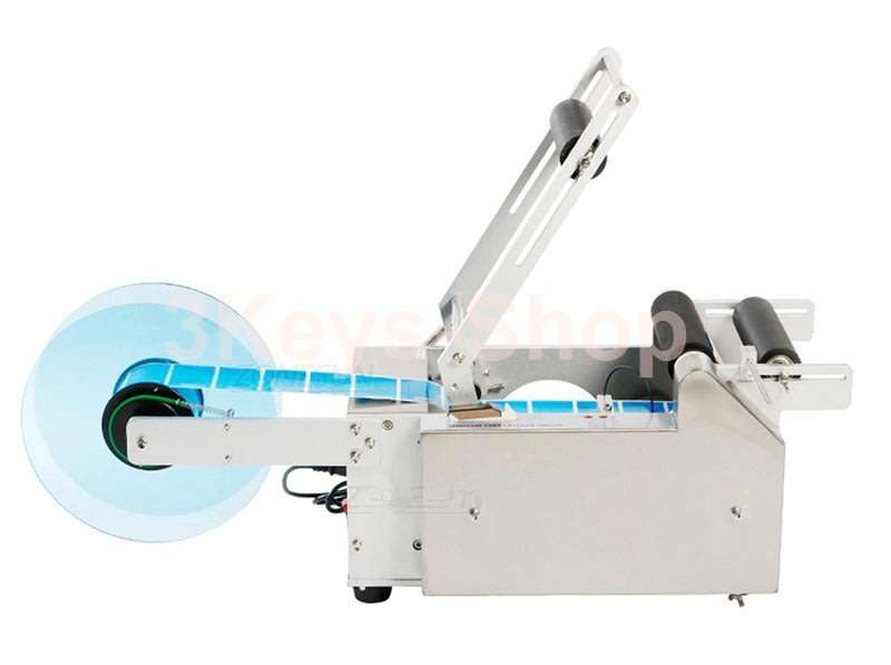 Automatic labeling machine for round bottles