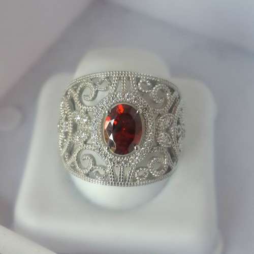 Delicate sterling silver ring with margazete diamante detail and a ruby gemstone