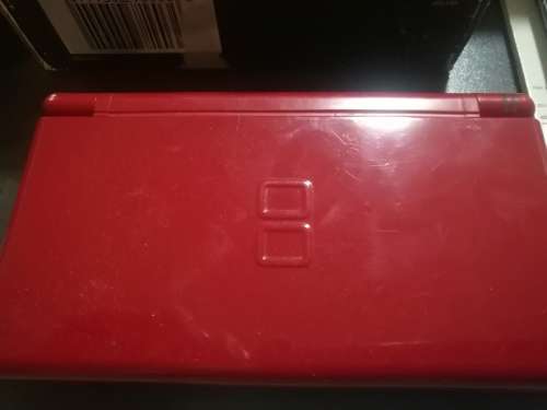 Red Nintendo DS Lite and 4 Games