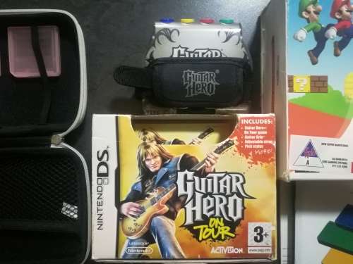 Red Nintendo DS Lite and 4 Games