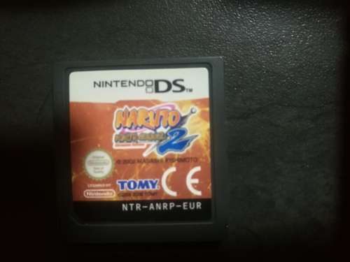 Red Nintendo DS Lite and 4 Games