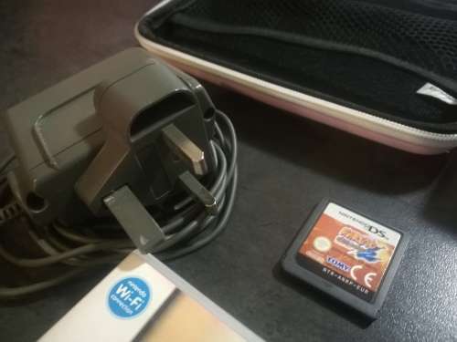 Red Nintendo DS Lite and 4 Games