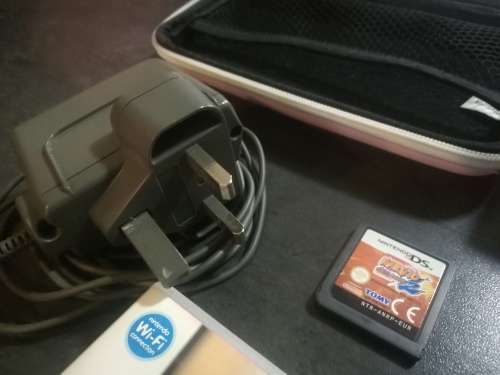 Red Nintendo DS Lite and 4 Games