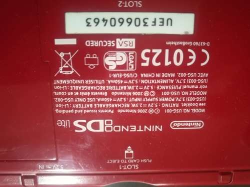 Red Nintendo DS Lite and 4 Games