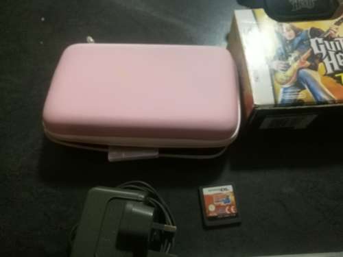 Red Nintendo DS Lite and 4 Games
