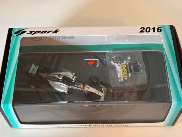 Nico Rosberg - 2016 Mercedes F1 `World Champion with figurine` (Rare Spark larger box 1:43)