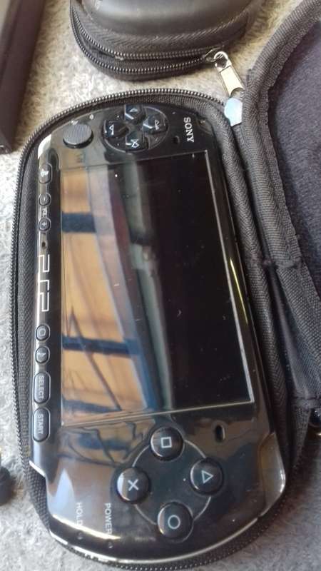 PSP, 5 games, charger and a PSP converter