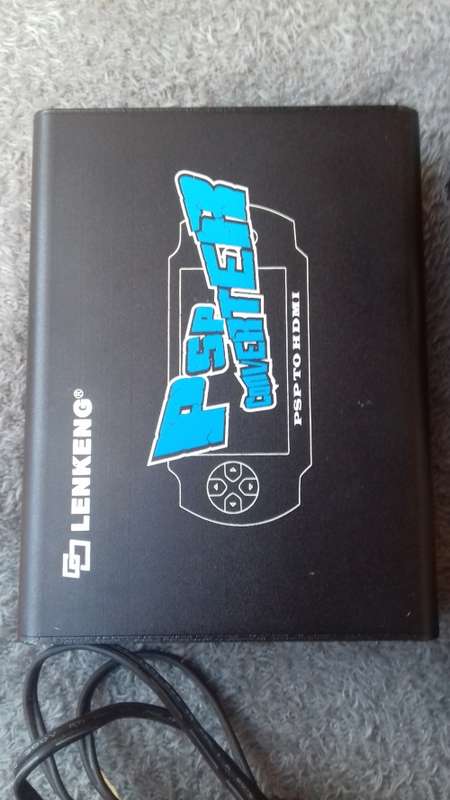 PSP, 5 games, charger and a PSP converter