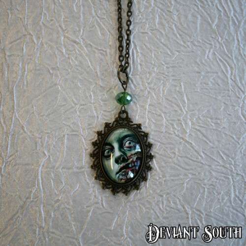 Deviant South `I Am Smiling` Cabochon Bronze Necklace - Green Zombie Face
