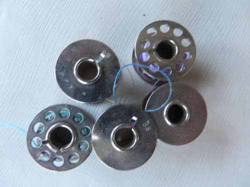 5 METAL SEWING MACHINE BOBBINS - AS PER SCAN