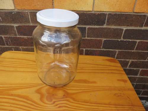 LARGE GLASS STORAGE JAR - 145 MM DIAM. - 235 MM HIGH - AS PER SCAN