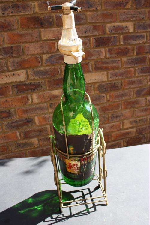 LARGE WHISKY BOTTLE IN STAND - J&B