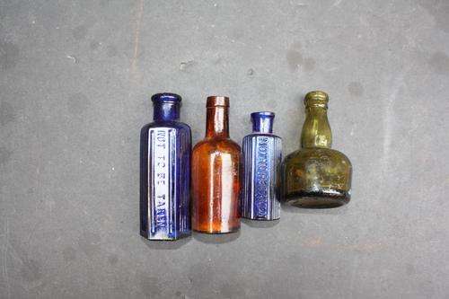 4 COLLECTABLE GLASS BOTTLES - PLEASE HAVE A LOOK