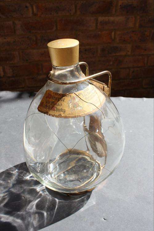 EMPTY BOTTLE OF DIMPLE IN BRASS STAND - 1.875 LTR.