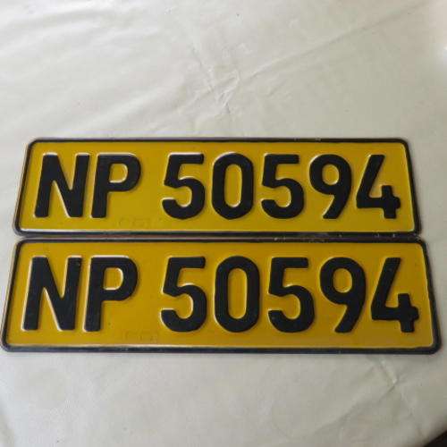 A PAIR OF YELLOW METAL NUMBER PLATES - NP 50954 - PLEASE HAVE A LOOK