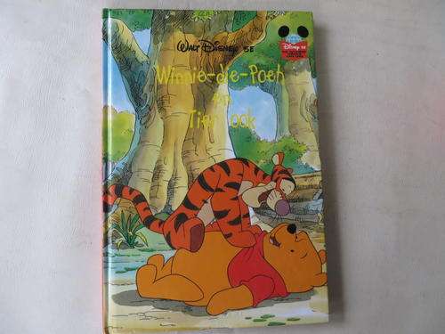 WALT DISNEY - WINNIE-DIE-POEH EN TIER OOK - GOOD CONDITION, SOME WEAR AND TEAR ON COVER