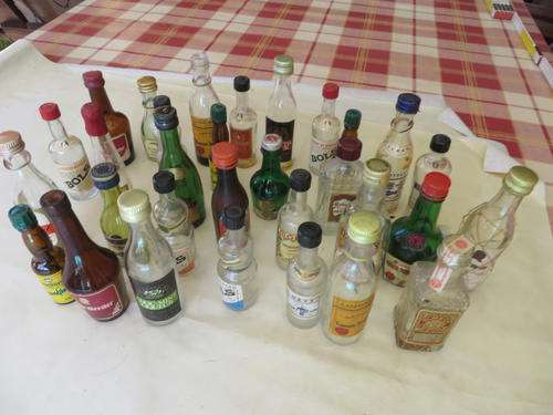 31 EMPTY SMALL GLASS BOTTLES - AS PER SCAN