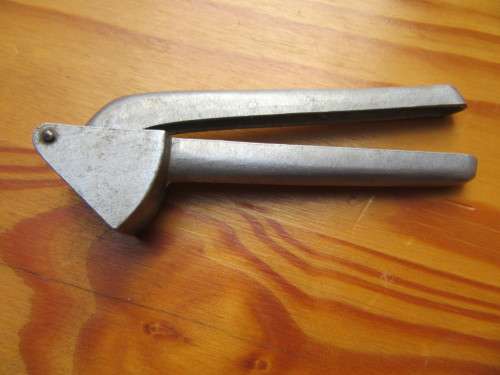 OLD GARLIC PRESS - AS PER SCAN