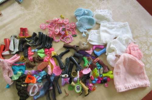 LARGE SELECTION OF DOLLS SHOES, CLOTHING AND OTHER DOLLS RELATED ITEMS - AS PER SCAN