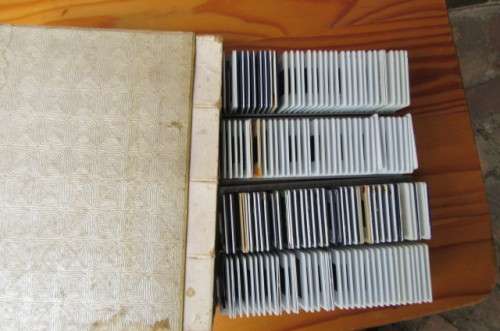 PLASTIC ALBUM WITH 4 X 36 UNCHECKED SLIDES - AS PER SCAN