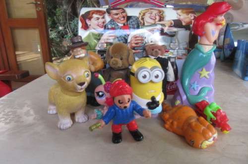 10 highly collectable toys in slightly dented coca cola lunch box