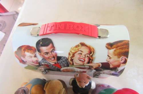 10 highly collectable toys in slightly dented coca cola lunch box