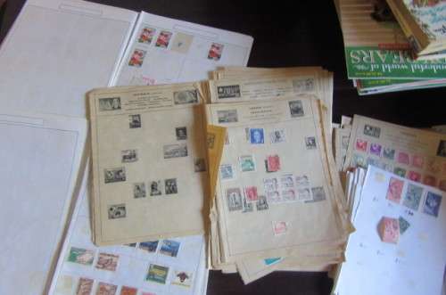 60 PAGES HINGED WITH WORLD STAMPS