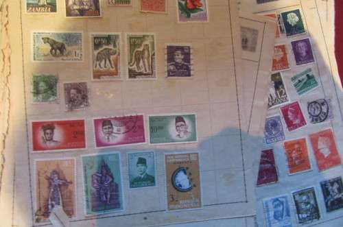 79 PAGES WITH HINGED WORLD STAMPS - BID PER PAGE