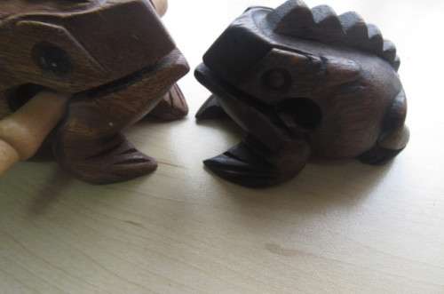 2 WOODEN NOISE MAKING FROGS ,SORRY ONE PIN ONLY - AS PER SCAN