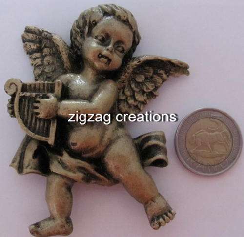 single small angel with harp.double sided tape.resin product
