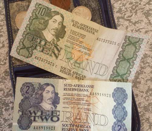 Old VOLKSKAS BANK denim wallet with old south african notes and coins