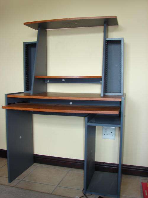 Stylish computer desk with place for tower, CD's and monitor