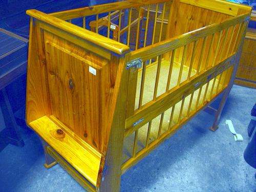 Solid Wooden Baby Cot: Side folds away for easy handling.